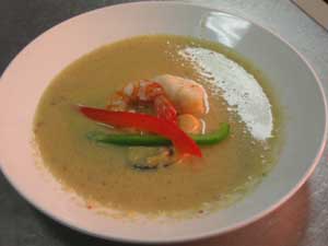 Pear and macadamia soup with grilled seafood